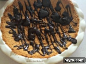 Close-up of S'mores Cream Pie showing the hot fudge drizzle