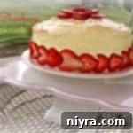 Side View of Strawberry Lemonade Cake on a white square cake plate and text "Strawberry Lemonade Cake"