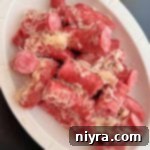 Smoked Polish Sausage and Sauerkraut 13 Polish Sausage & Sauerkraut in a white serving dish