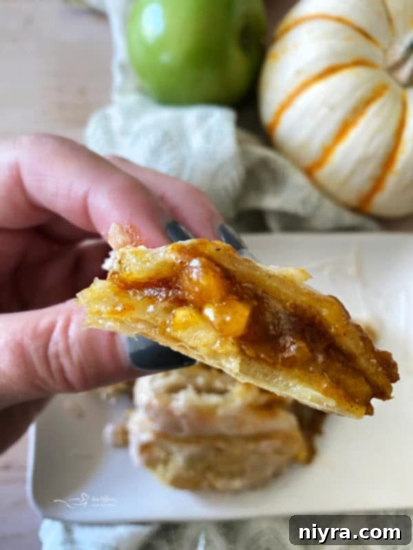 one piece of apple pumpkin strudel in hand 