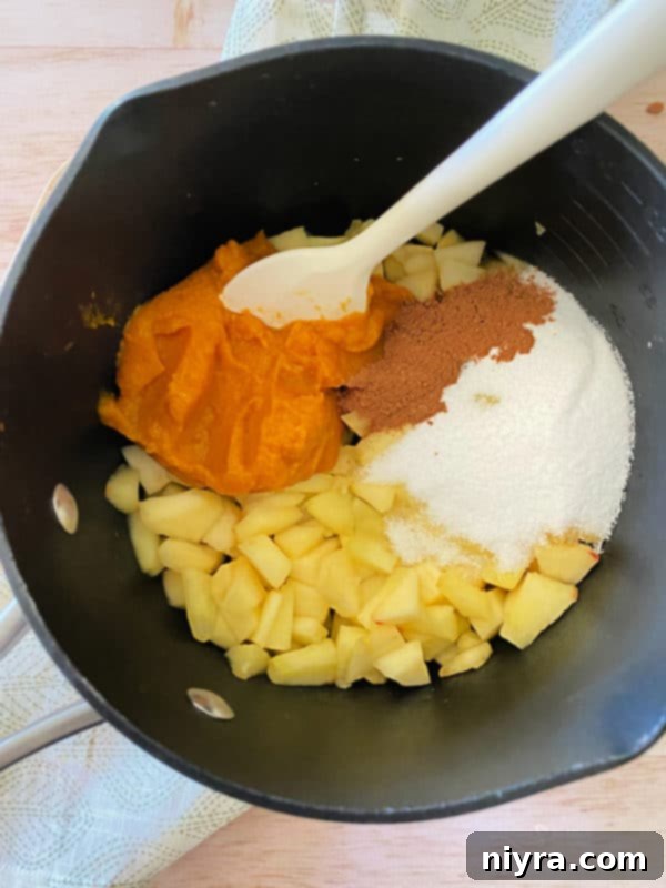 mixing pumpkin, apples, cinnamon, sugar in bowl 