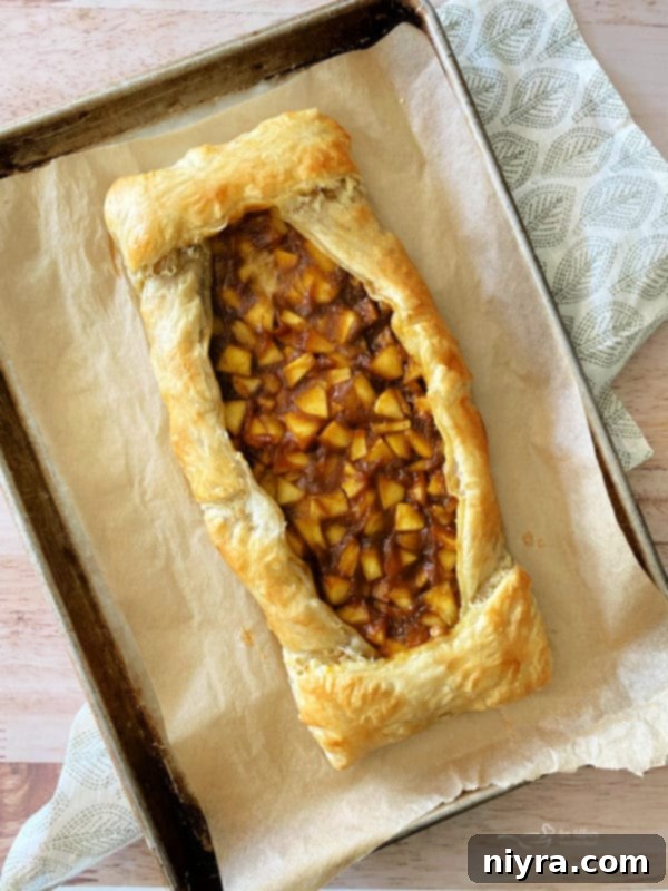 baked apple pumpkin strudel on baking sheet