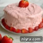 Luscious Strawberry Delight 12 Strawberry Cake on a white plate