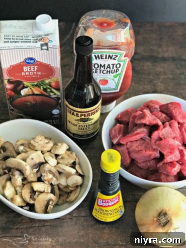 Assorted ingredients laid out for preparing Beef Tips & Gravy, including beef, vegetables, and seasonings.