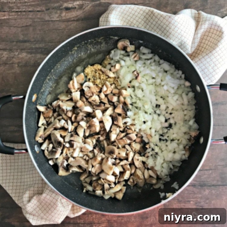 Early stages of Beef Tips & Gravy preparation, showing sautéed vegetables in a pan.