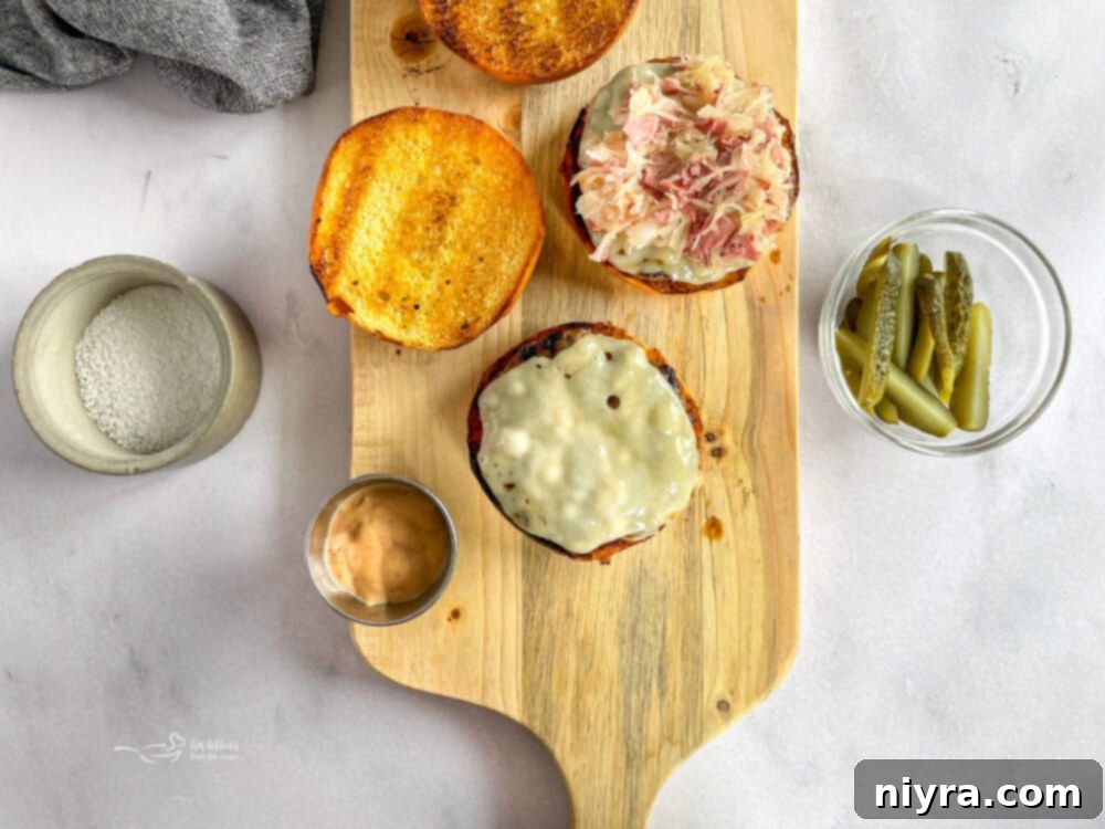 Assembling the Reuben Burgers with all ingredients