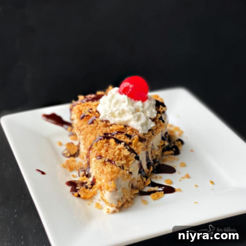 A whole fried ice cream pie, sliced, with garnishes and chocolate