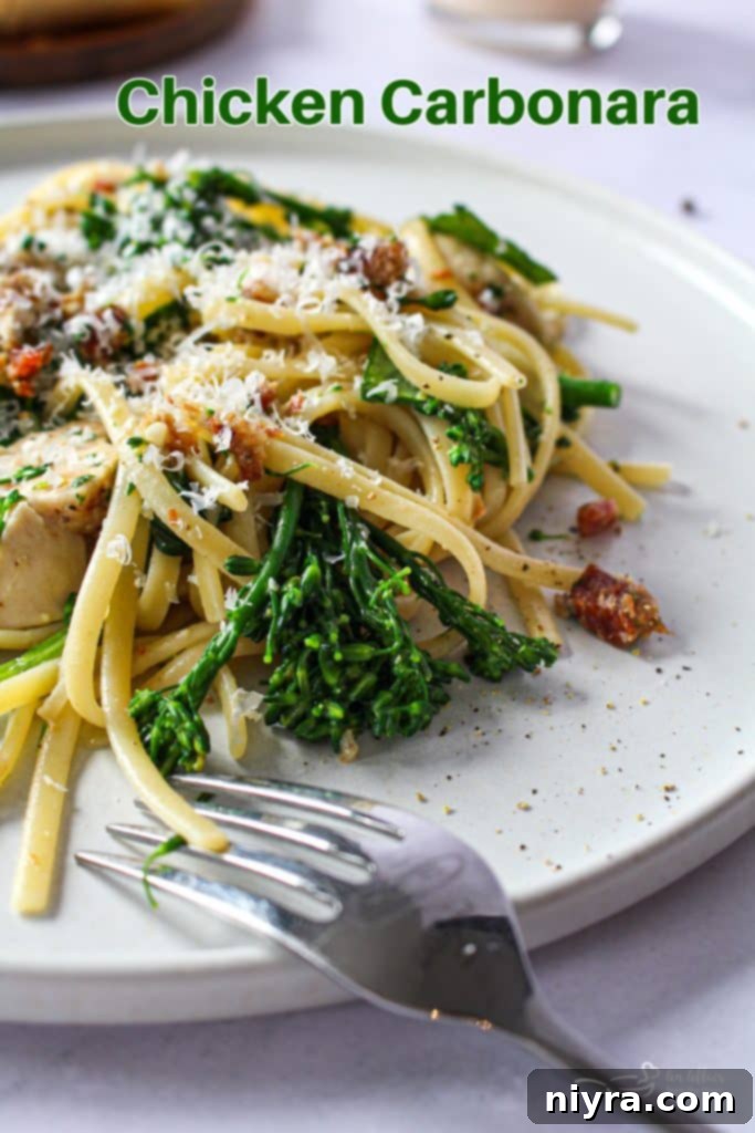 A hero shot of the Chicken Carbonara, perfectly plated and ready to be served, highlighting its rich textures and colors.
