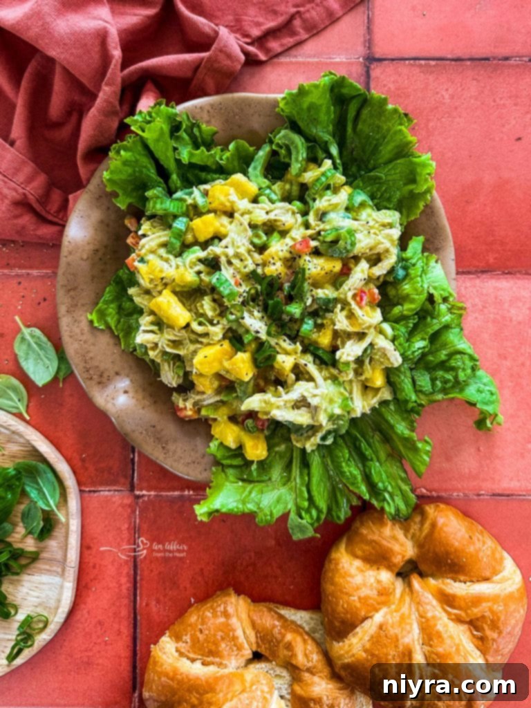 A vibrant Peach Basil Chicken Salad served beautifully on a plate.