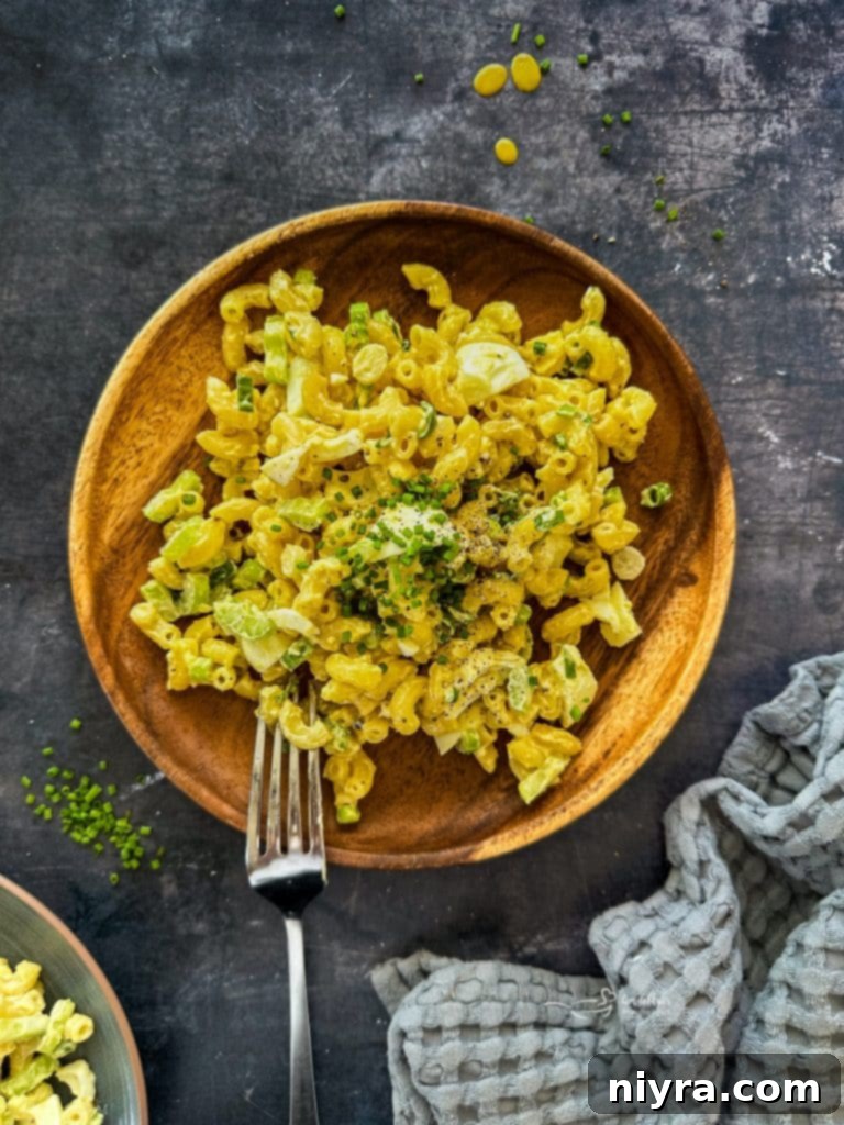 Close-up of Mom's Macaroni Salad, showcasing the creamy dressing and fresh ingredients.