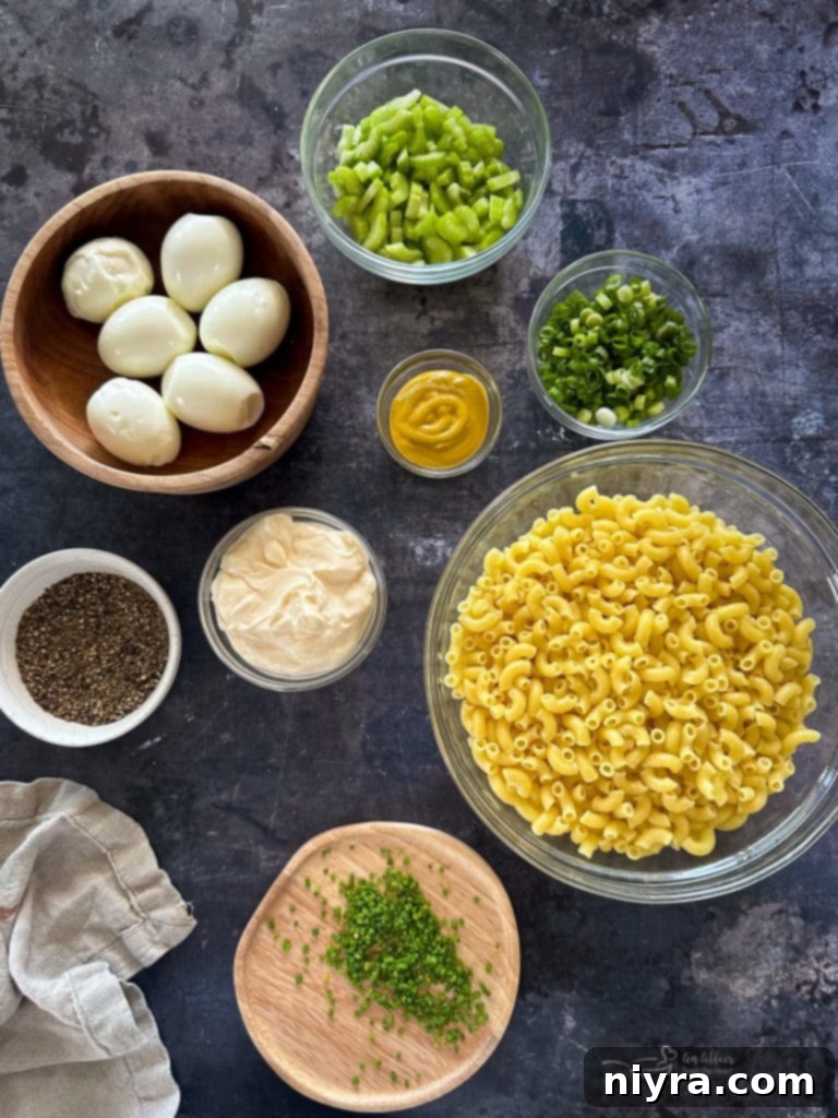 A large serving bowl filled with Mom's Macaroni Salad, garnished beautifully, on a rustic wooden table.