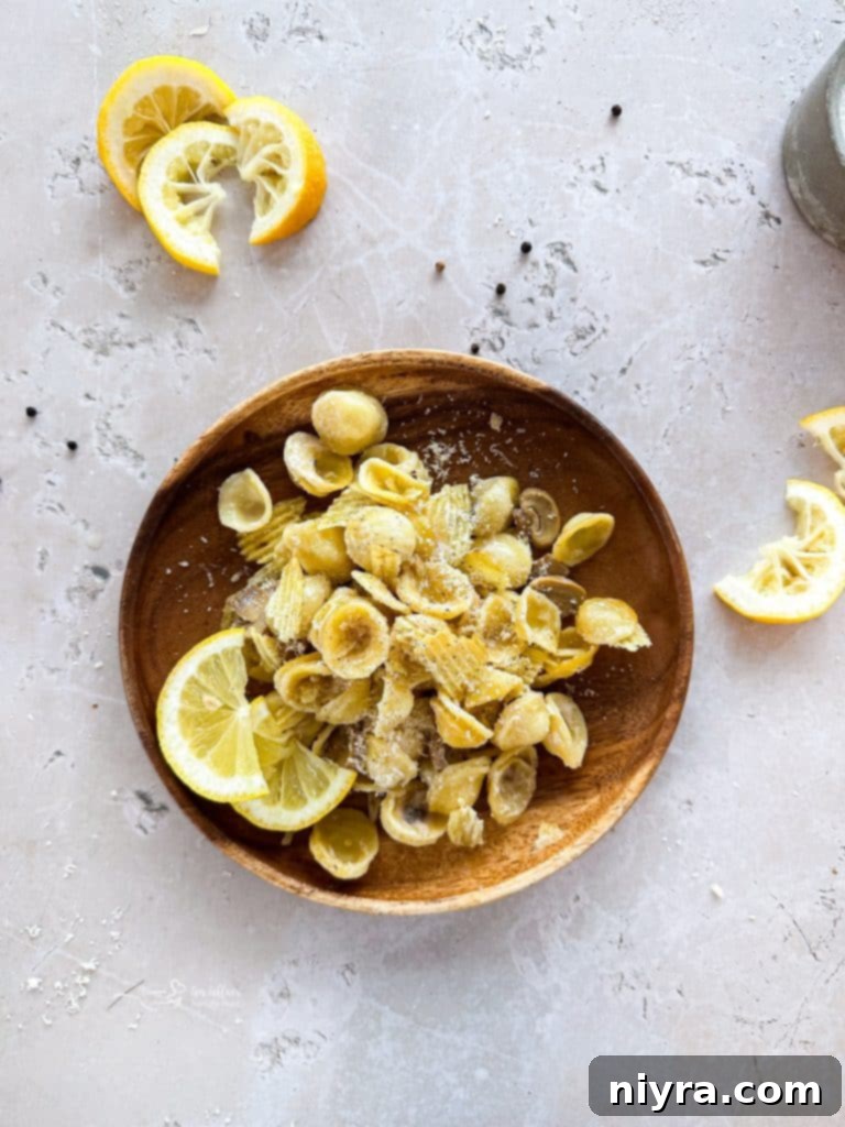 A pan of Tuna Tetrazzini Casserole before baking, showcasing the pasta and creamy sauce.