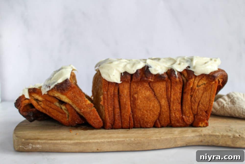 Warm Cinnamon Pull Apart Delight 2 Delicious Cinnamon Pull Apart Bread with Cream Cheese Frosting drizzle