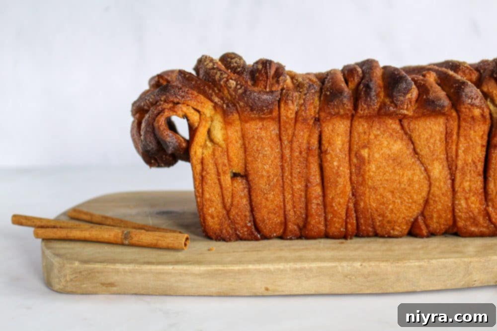 Warm Cinnamon Pull Apart Delight 3 Frosted Cinnamon Pull Apart Bread on a clean white platter