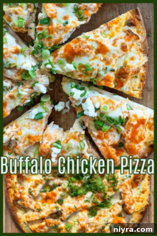 Vertical shot of a whole buffalo chicken pizza on a wooden surface