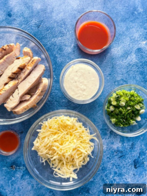 Buffalo chicken pizza, freshly baked and topped with green onions