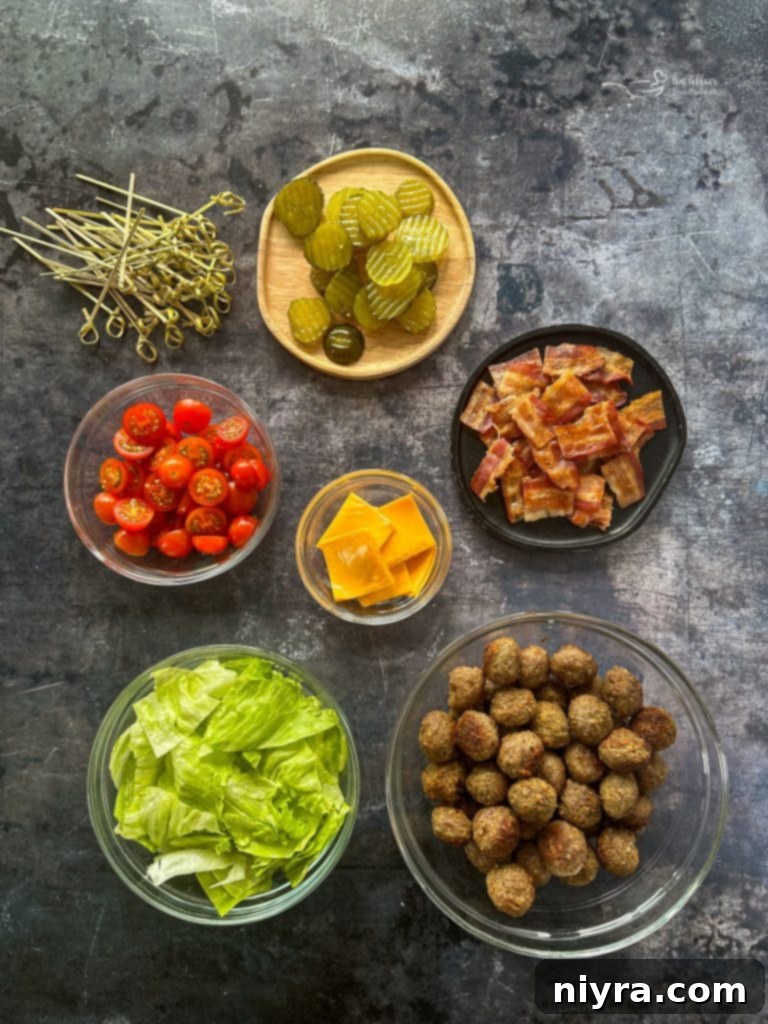 Close up of Bacon Cheeseburger Meatballs with fresh garnishes