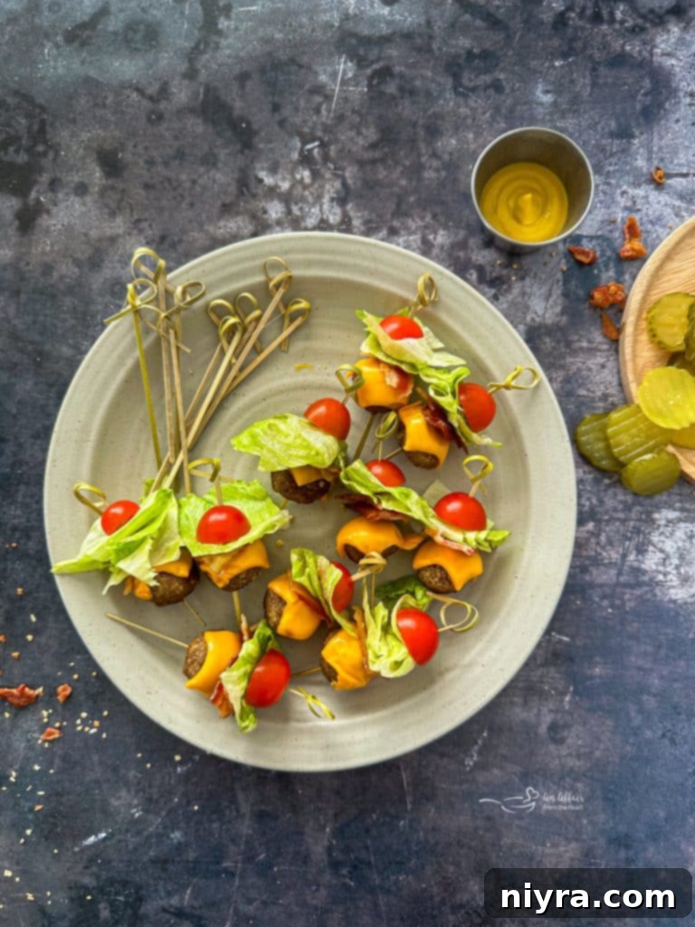 Assembling Bacon Cheeseburger Meatballs with toothpicks