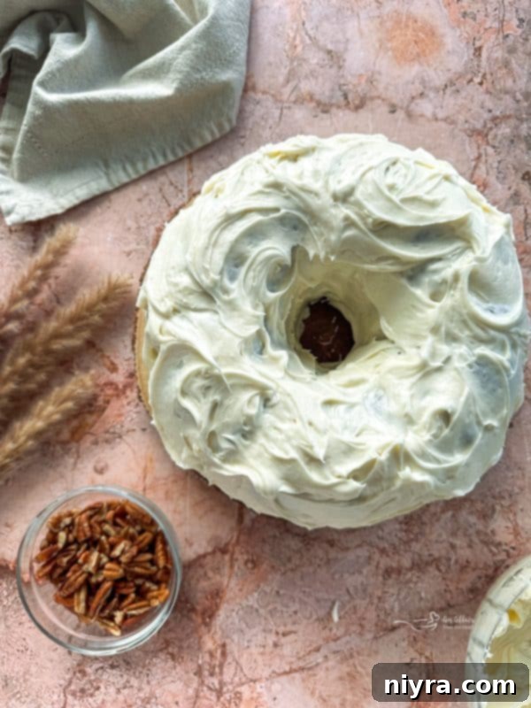 Cinderella Pumpkin Bundt Cake with Cream Cheese Frosting 13 Making cream cheese frosting for the bundt cake, showing the creamy texture