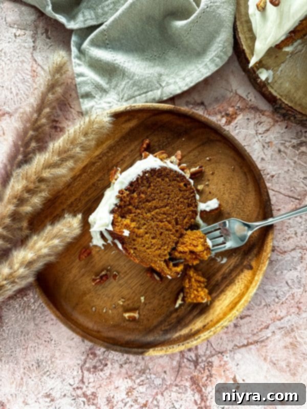 Cinderella Pumpkin Bundt Cake with Cream Cheese Frosting 17 A beautifully presented Pumpkin Bundt Cake, showcasing its festive appeal.