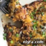 spoon scooping Bubble Up Enchilada