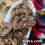 broken up pieces of graham cracker toffee with pecans