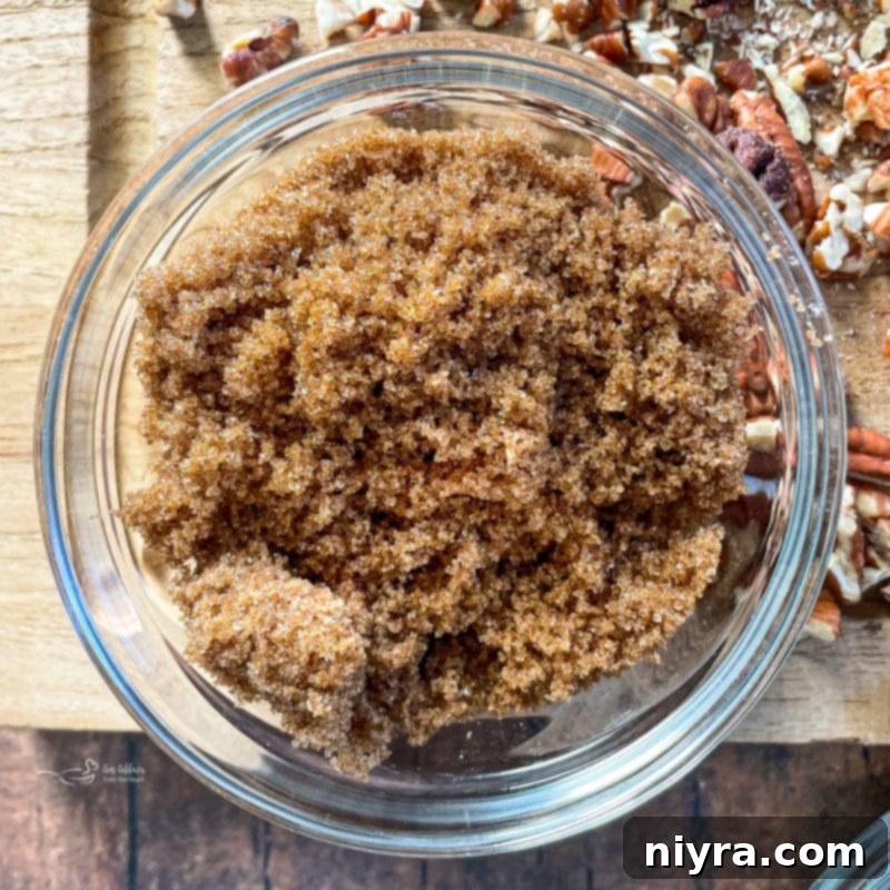 Bowl filled with light brown sugar, a key ingredient for the toffee.