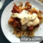 Chuckwagon Chicken 2 Overhead of Cowboy Chicken on a white plate with text "cowboy chicken"