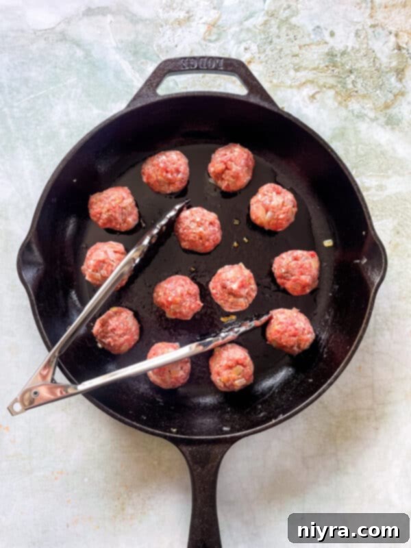 Step 4: Browning meatballs in a skillet.