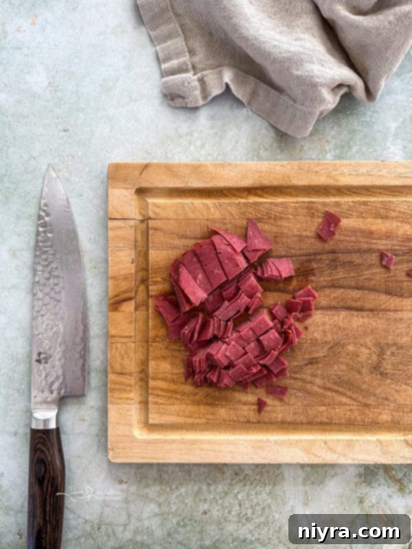 Dill Pickle Dip in a glass bowl with a spoon