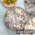 Dill Pickle Dip in a bowl surrounded by crackers