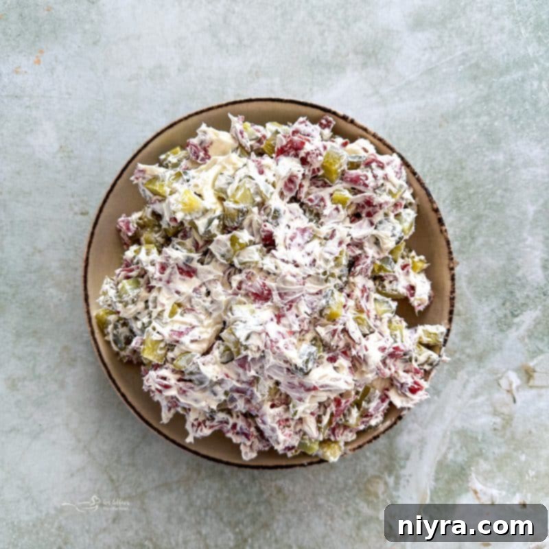 Dill Pickle Dip in a bowl, stirred and ready