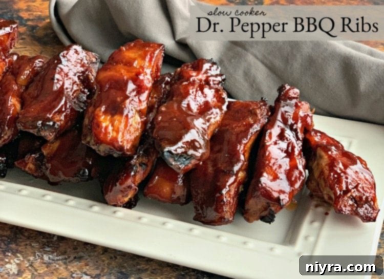 Beautifully plated Slow Cooker Dr. Pepper BBQ Ribs, garnished with fresh herbs.
