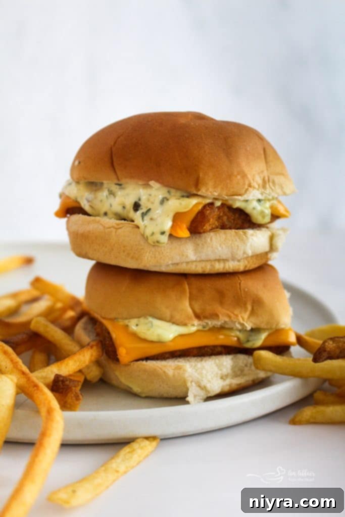 Close-up of a homemade McDonald's Filet-O-Fish sandwich with a soft bun, crispy fish, and melty cheese.