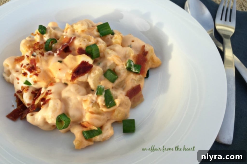 Fully Loaded Mac 'n Cheese 3 Close-up of creamy, rich Loaded Mac 'n Cheese with green onions and bacon