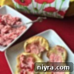 Old Fashioned Pop Overs with Cherry Butter spread on it