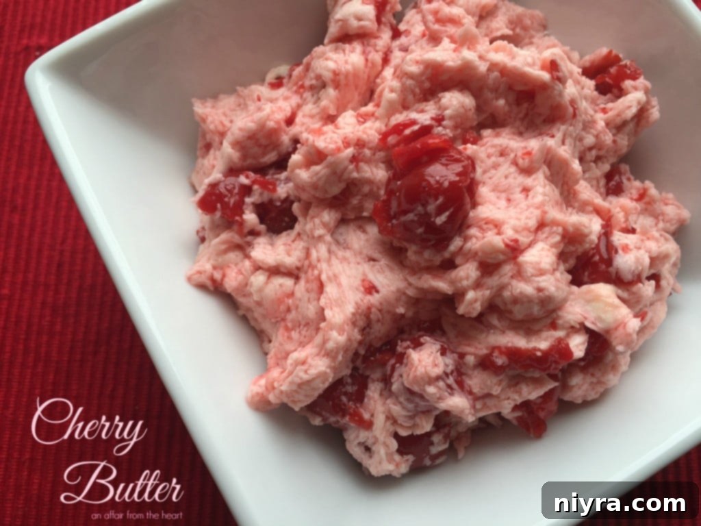 Homemade Cherry Butter in a small bowl with a spoon