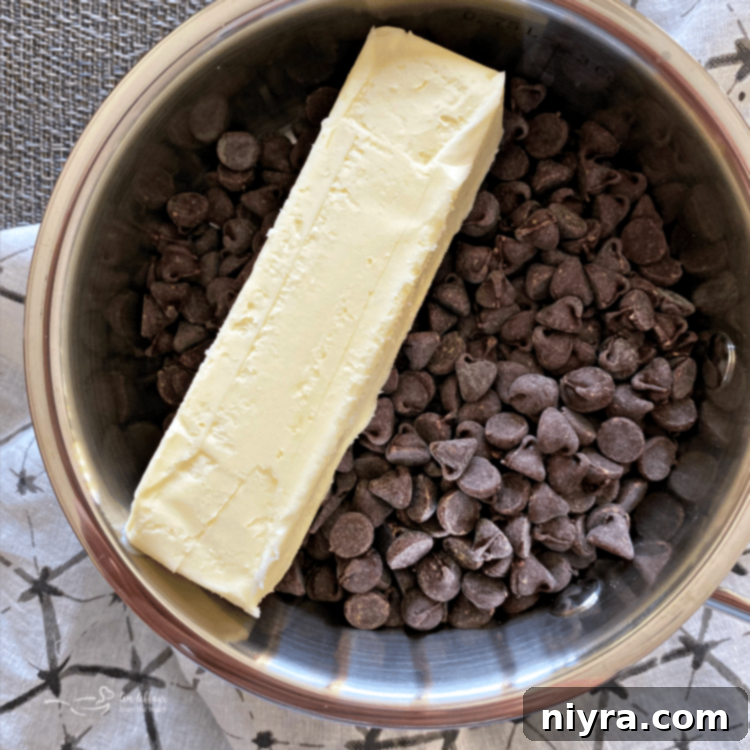 Ingredients for chocolate frosting being mixed in a bowl