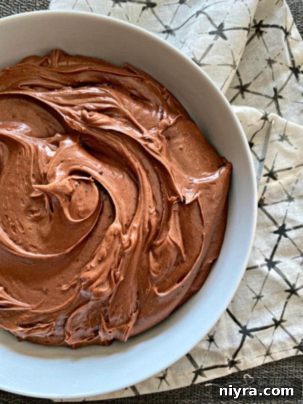 Close-up of fluffy sour cream chocolate frosting ready for application