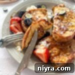 Close up of the Best French toast on a fork.