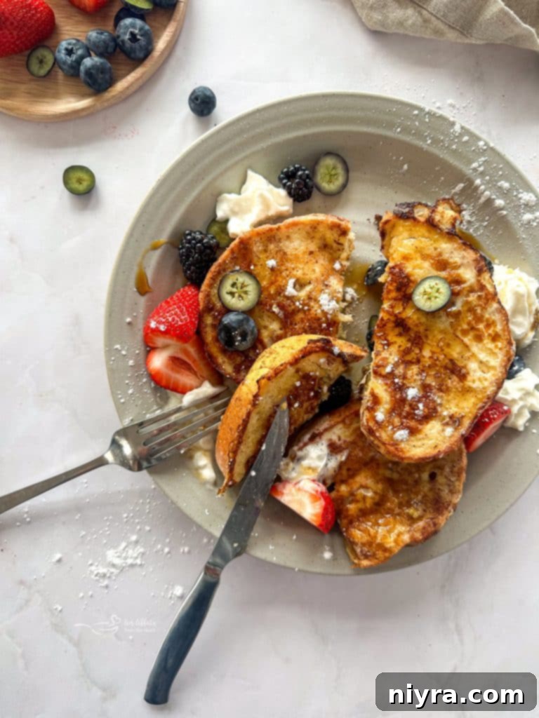 Perfectly cooked French toast slices ready to be served, with a hint of cinnamon.