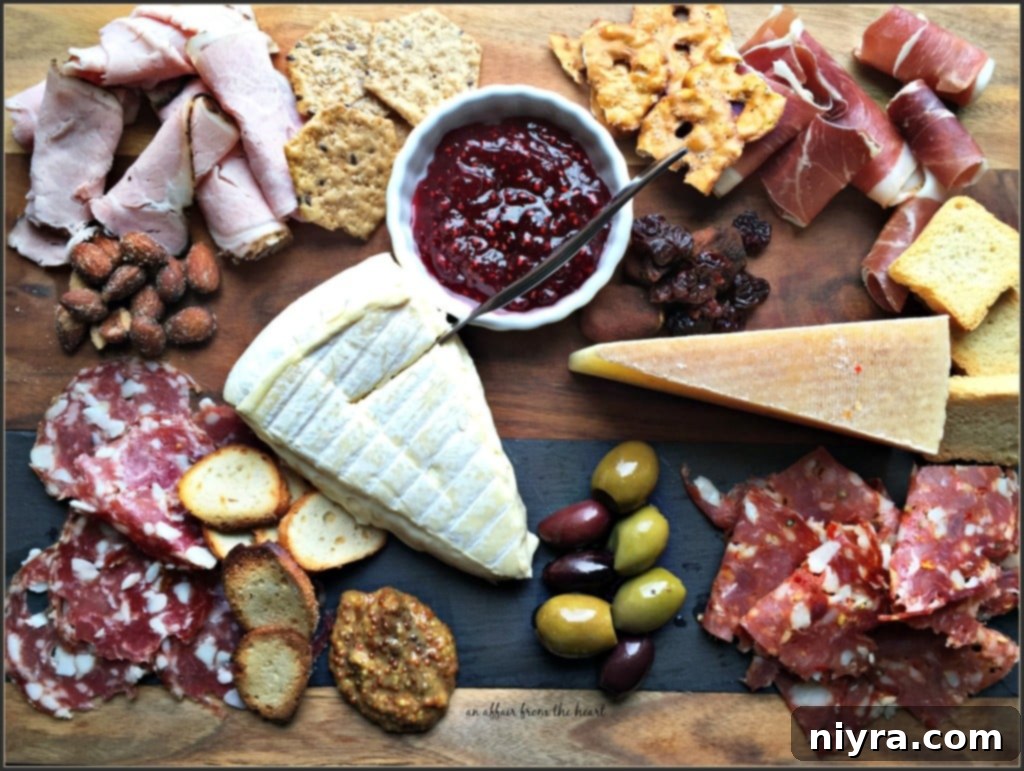 Exquisitely arranged charcuterie board featuring meats, cheeses, fruits, and crackers