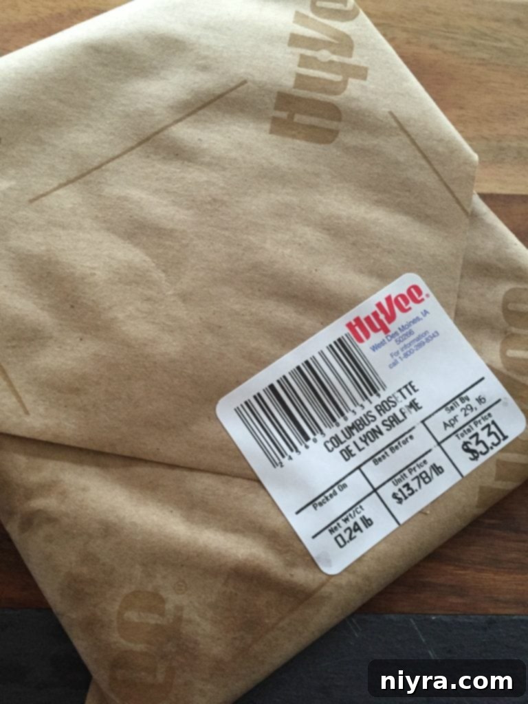 Close-up of cheese and salami on a charcuterie board