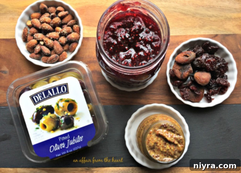 Charcuterie board in progress with olives and crackers