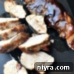 Pork Tenderloin on a black slate with text 'Sweet Balsamic Glazed Pork Tenderloin'