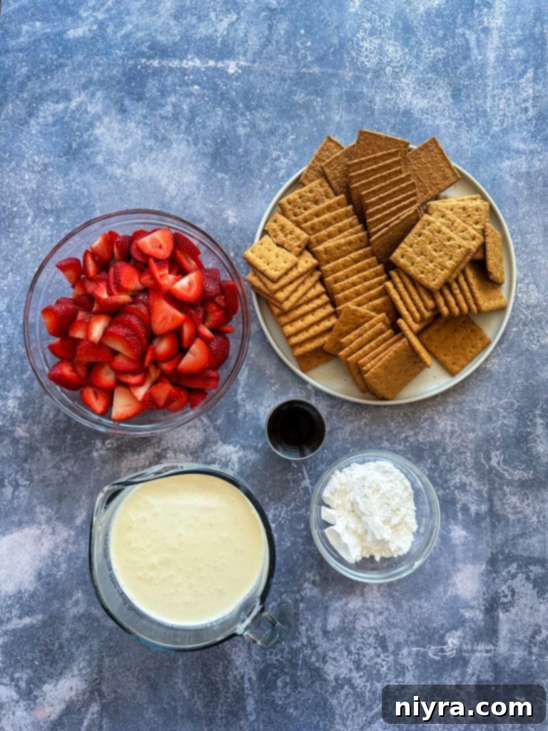Layered Strawberry Icebox Cake in a baking dish, ready to be chilled.