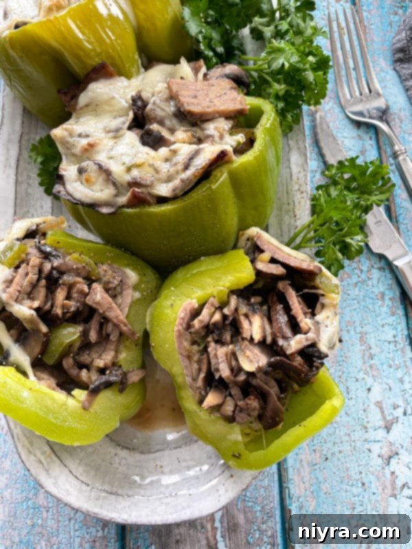 Loaded Philly Cheesesteak Peppers 2 Keto-friendly Philly Cheesesteak Stuffed Peppers served on a plate