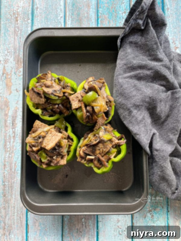 Loaded Philly Cheesesteak Peppers 13 Philly Cheesesteak Stuffed Peppers covered in a baking pan