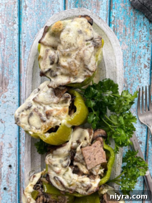 Loaded Philly Cheesesteak Peppers 3 Stuffed peppers with Philly cheesesteak filling and garnishes