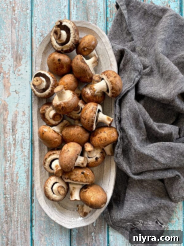 Loaded Philly Cheesesteak Peppers 5 Overhead shot of sliced mushrooms on a plate